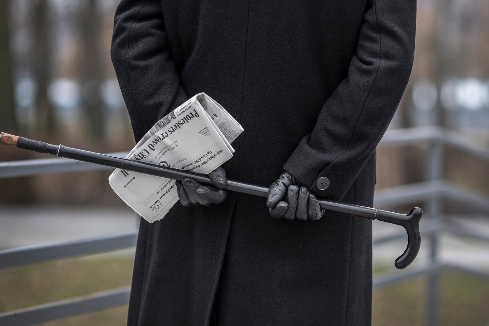 back view elderly man holding cane