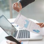 modern company teem coworking using graphs laptop office